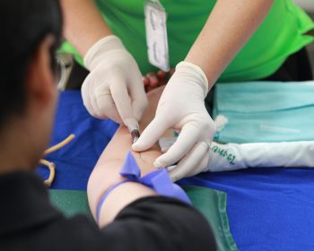 Person Getting His Blood Check